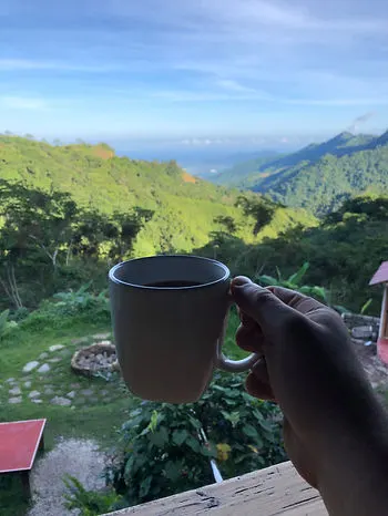 a man having local coffee at Casas Viejas in Minca Colombia in the morning