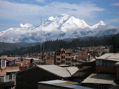 city view of Huaraz, Peru with glaciers and mountains in the background