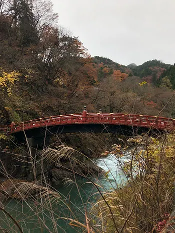Shinkyo Bridge in Nikko on a cloudy day during Fall
