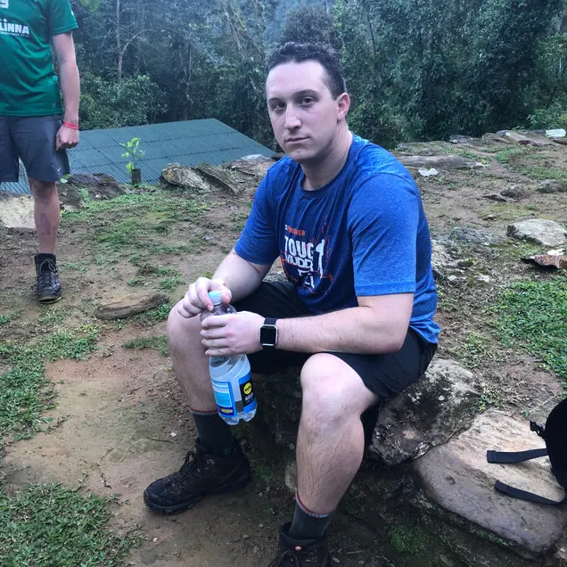 A tired and worn out American hiker in Colombias Lost City Trek in the Santa Marta's jungle region