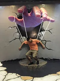 forced perspective of a puppet hand at Chiang Mai 3D Art Museum