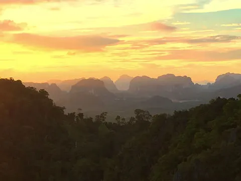 sunset from Tiger Cave Temple, Krabi, Thailand with limestone cliffs