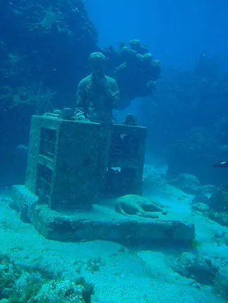 scuba diving at the MUSA underwater art museum on Isla Mujeres Mexico