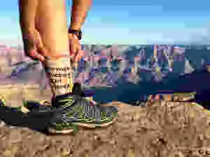 mother fucking girl power socks on a female traveler in the American desert