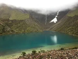 Humantay Lake on the Salkantay Trek with a glacier in the backgound near Cusco Peru